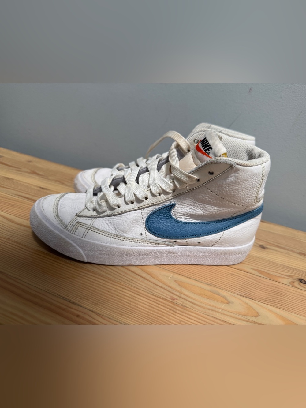 Nike White Leather High-Tops with Blue Swoosh